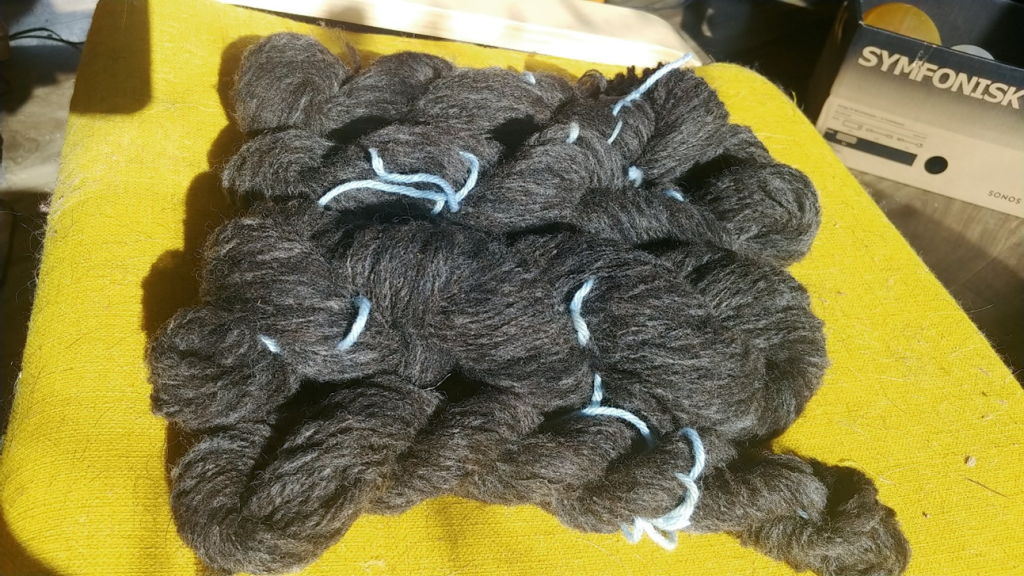 Newly spun yarn against yellow rest